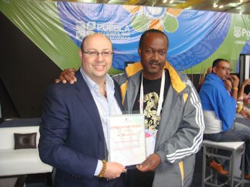 Master Michael Sirota receiving a Certificate of Appreciation from the Mr. Ronald Philip - President - Barbados Taekwondo Association
