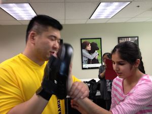 Instructor working with a visually impaired girl @ Canadian National Institute for the Blind.